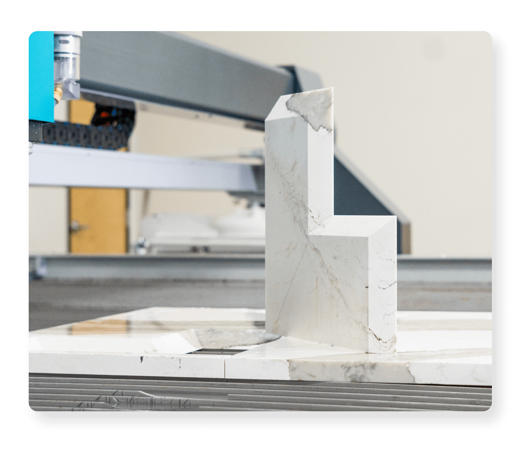 Quartz cut part with bevel sitting on waterjet cutting table.