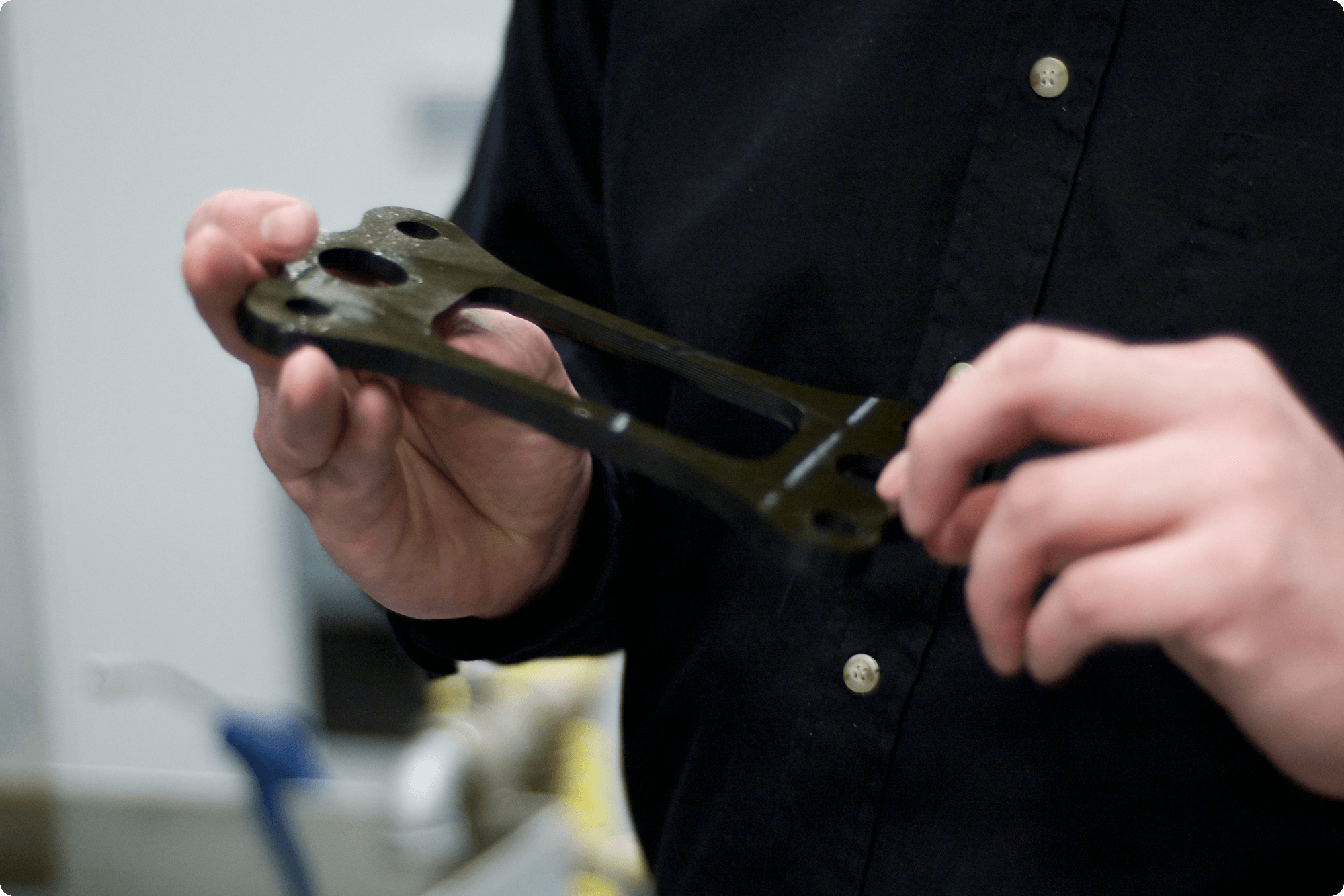 hands holding a cut part